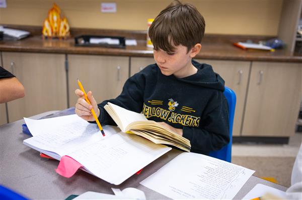 Students inside their classrooms learning. 